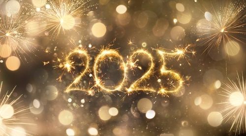 The number 2025 surrounded by golden sparkles