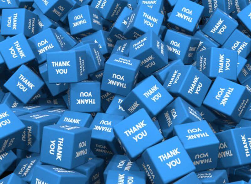 A pile of blue cubes. Each face of the cubes reads 'THANK YOU'.